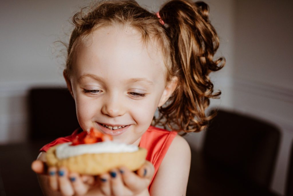 closeup of child eating a cookie